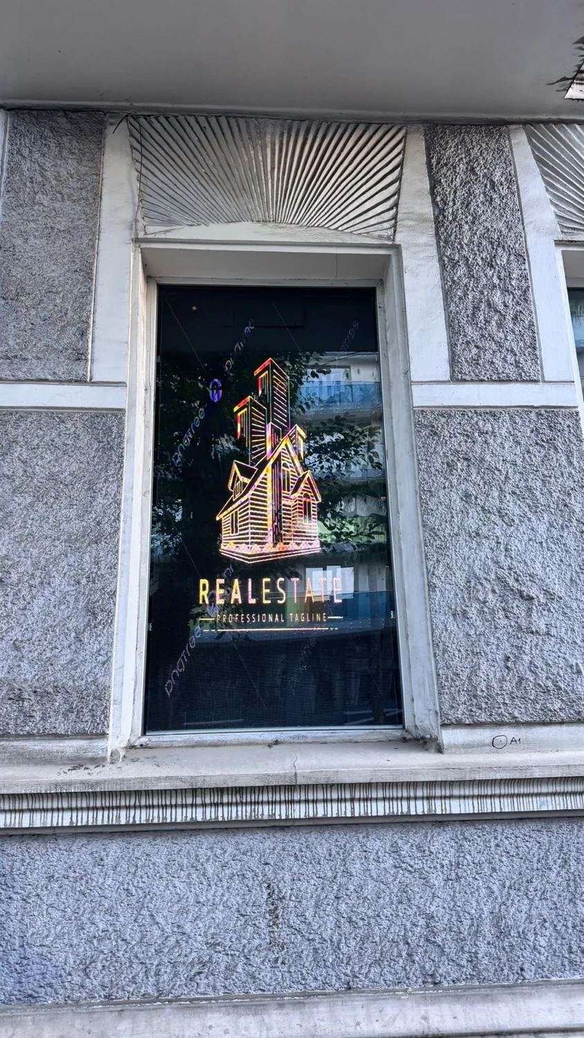 LED display inside real estate office window